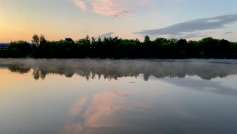 smoke over the water and beautiful reflection of clouds (4k60)