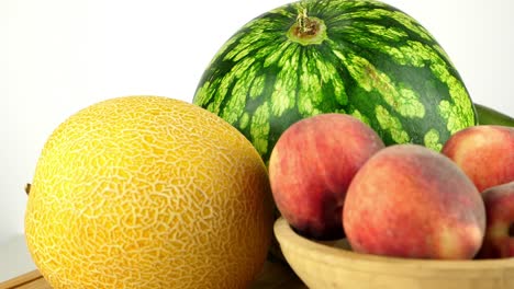 Rotating-shot-of-fresh-looking-tropical-fruit-against-a-white-backdrop