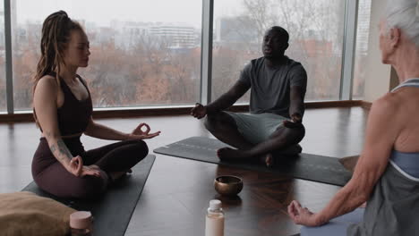 group meditation session in a modern yoga studio