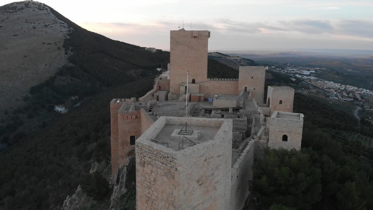Jaen's Castle Saint Catalina Castle Spain shoot with a drone at 4k 24fps showing the exterior and the city from multiple points on a afternoon in December.