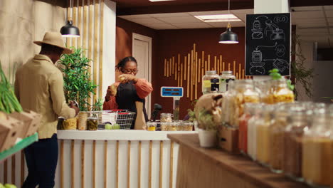 merchant placing all produce on electronic scale at checkout