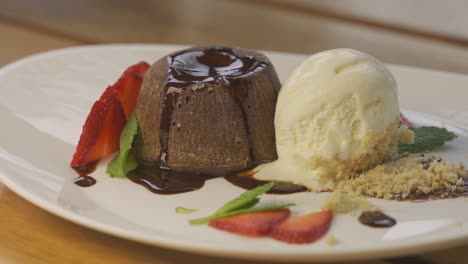 chocolate volcano lava and vanilla ice cream dessert