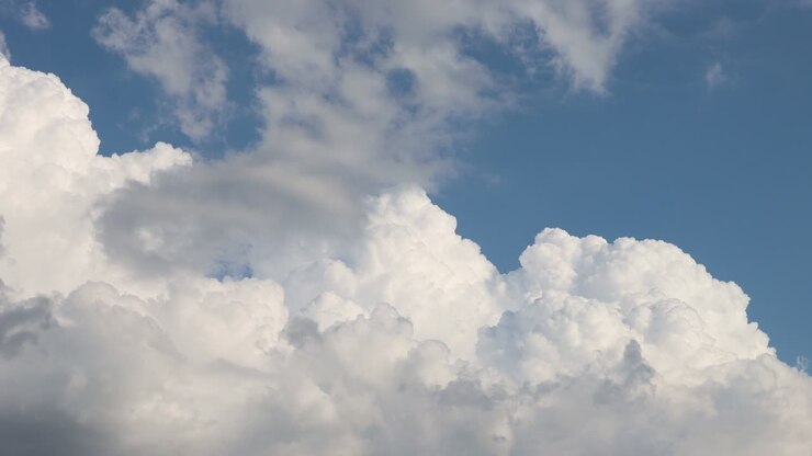 White clouds on blue sky. 4k Timelapse footage.