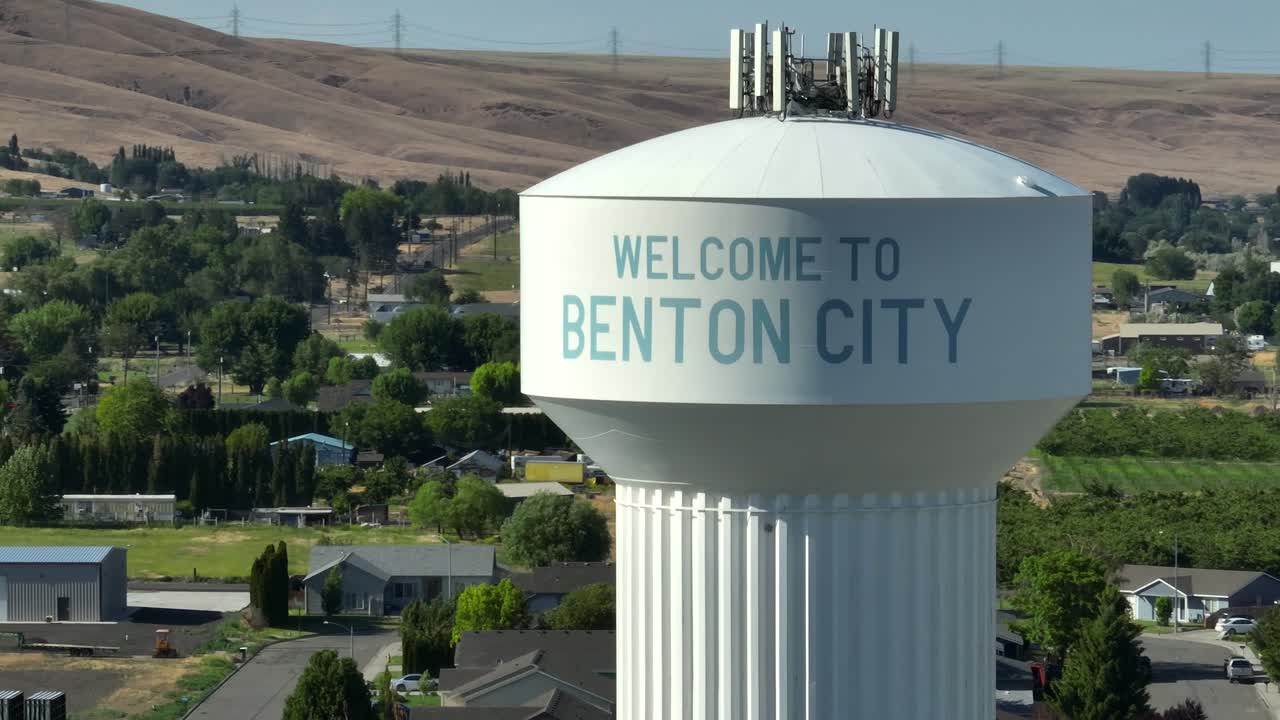 Tight orbiting aerial of Benton City's water tower