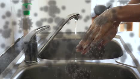 animation of covid 19 cells over person washing hands