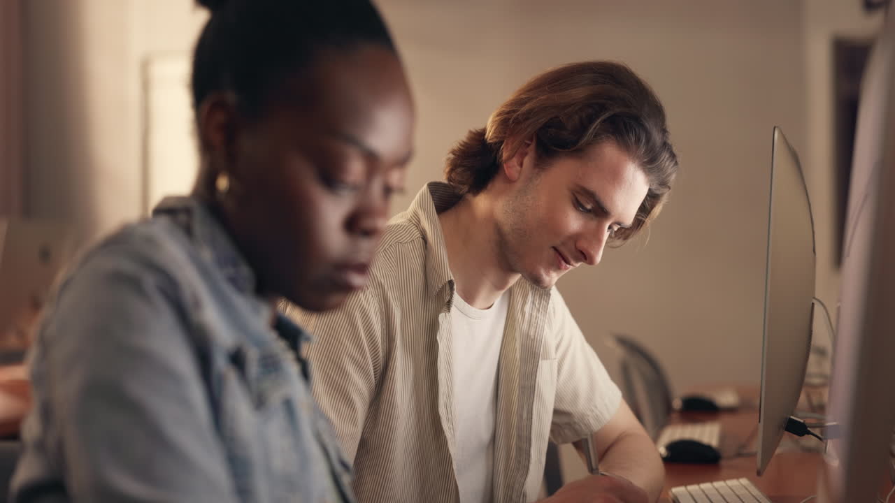 Students in a computer lab discussing