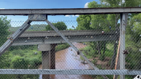 Lots-of-padlocks-on-fence-over-San-Pedro-river-bridge-in-Sierra-Vista