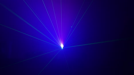 colorful rays of laser lights at night