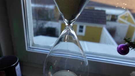 hour glass in front of the window