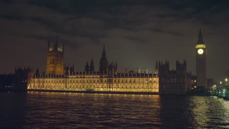 wide shot showing the houses of parliament, big ben clock and the river thames in westminster, london in the united kingdom. produced in 4k, 50 frames per second and in rec709 color space.