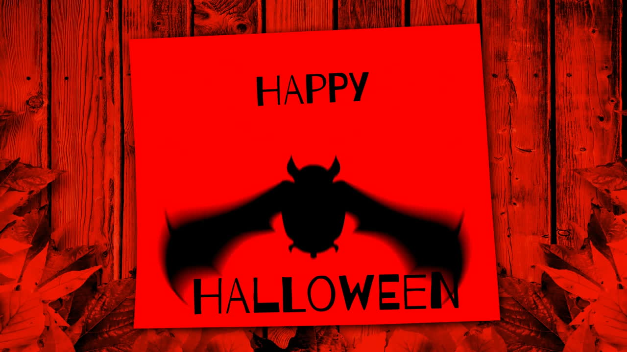 나무 바탕과 가을 잎 위에 박 실루을 가진 행복한 할로윈 텍스트