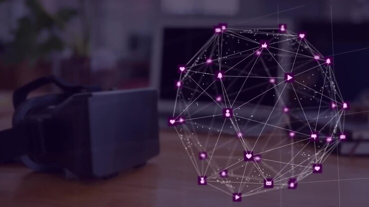 Animation of connected icons forming globe over headset and laptop on desk