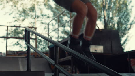 energetic guy jumping roller skates at skate park. man performing jump trick.
