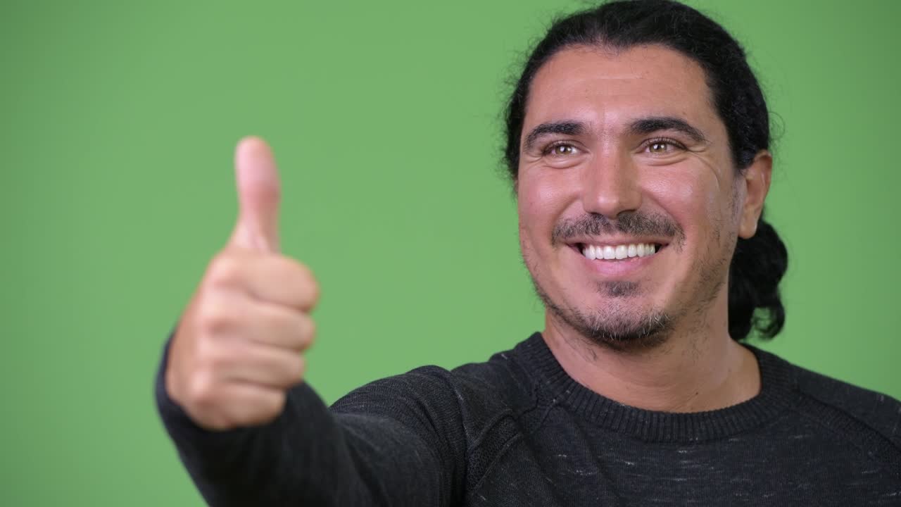 Handsome man giving thumbs up