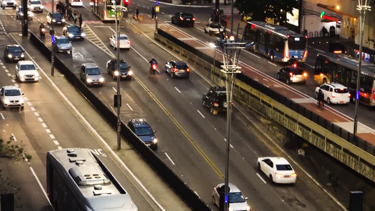 skyscrapers and busy car traffic in famous Paulista avenue in Sao Paulo city. High angle, tilt down