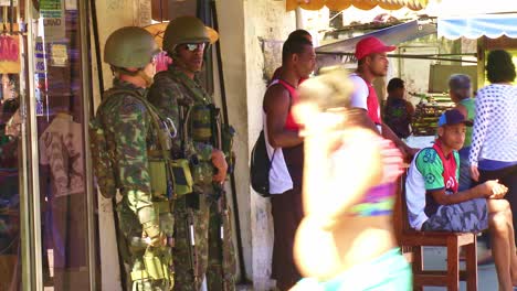 brazilian military police officers on patrol in a city street