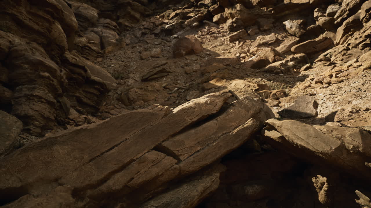 Rocky terrain with shadows and light effects in a natural setting
