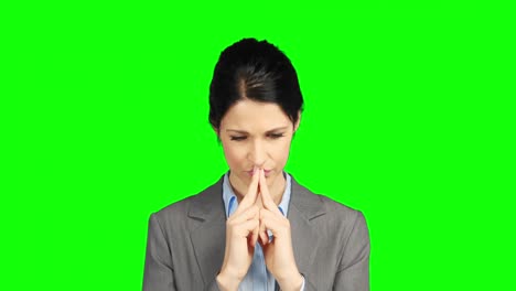 worried businesswoman holding her head