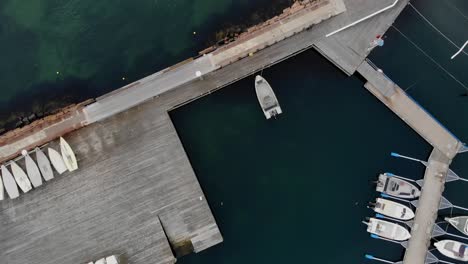 Overhead-aerial-of-marina-with-boats-in-Lysekil,-Sweden