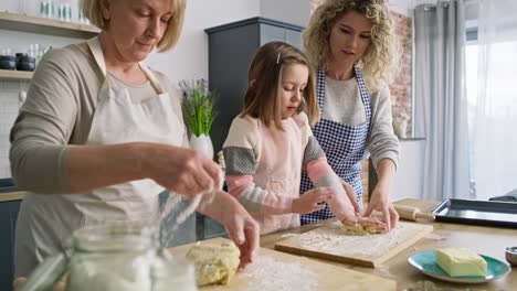 video of three women kneading dough in the kitchen