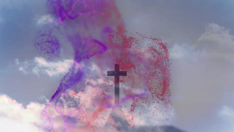colorful smoke swirling around cross silhouette with animation in cloudy sky background