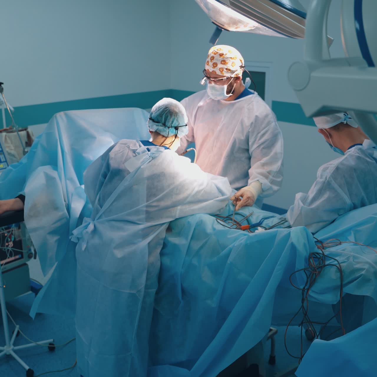 Team surgeon at work in operating room. Abdominoplasty of the abdomen. Modern equipment in operating room.