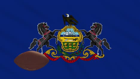la bandera de pensilvania agita y la pelota de fútbol americano gira, en bucle