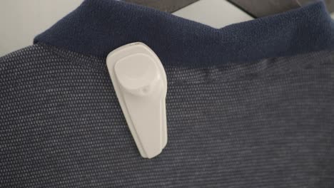 close-up of a security tag attached to a shirt