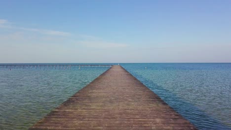 a flight over a wooden pier in the sea 01