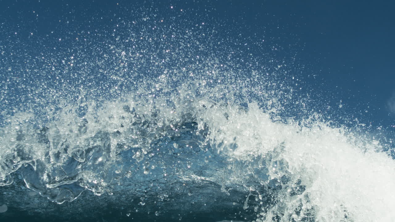 Underwater establishingwith dim light as massive wave crashes overhead in slow motion