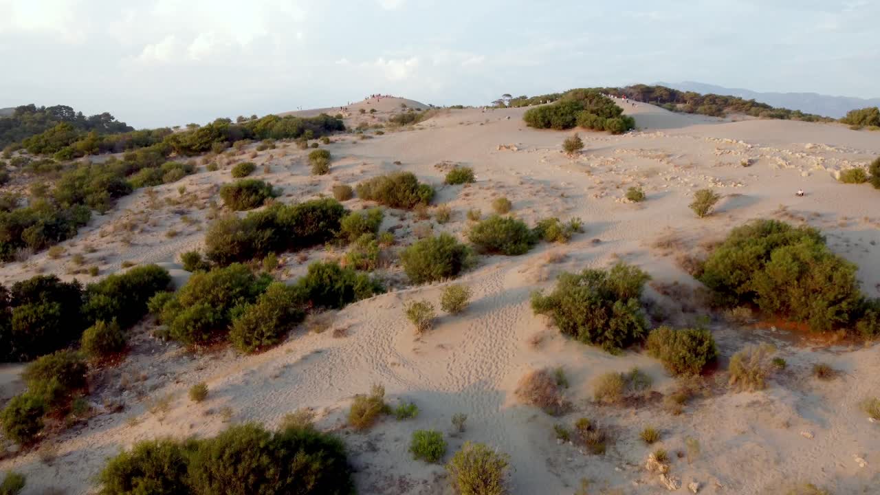 Expansive sand dunes stretch across Patara Beach, with an open horizon and calm waters, capturing Turkey’s natural beauty