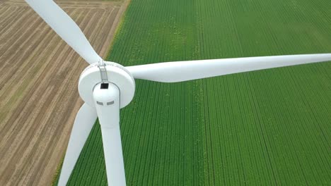 Tilting-ascending-shot-of-wind-turbine-in-British-countryside