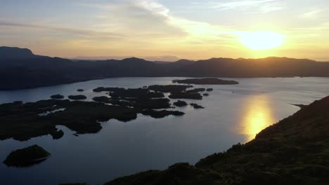 Slow-motion-HD-shot-of-the-beautiful-landscape-with-a-bright-sunlight-in-a-hilly-mountain-and-island-place-in-a-natural-background-at-Loch-Maree