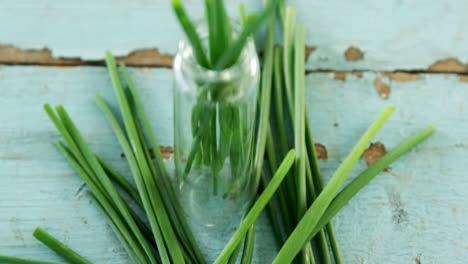 garlic chives on wooden table 4k