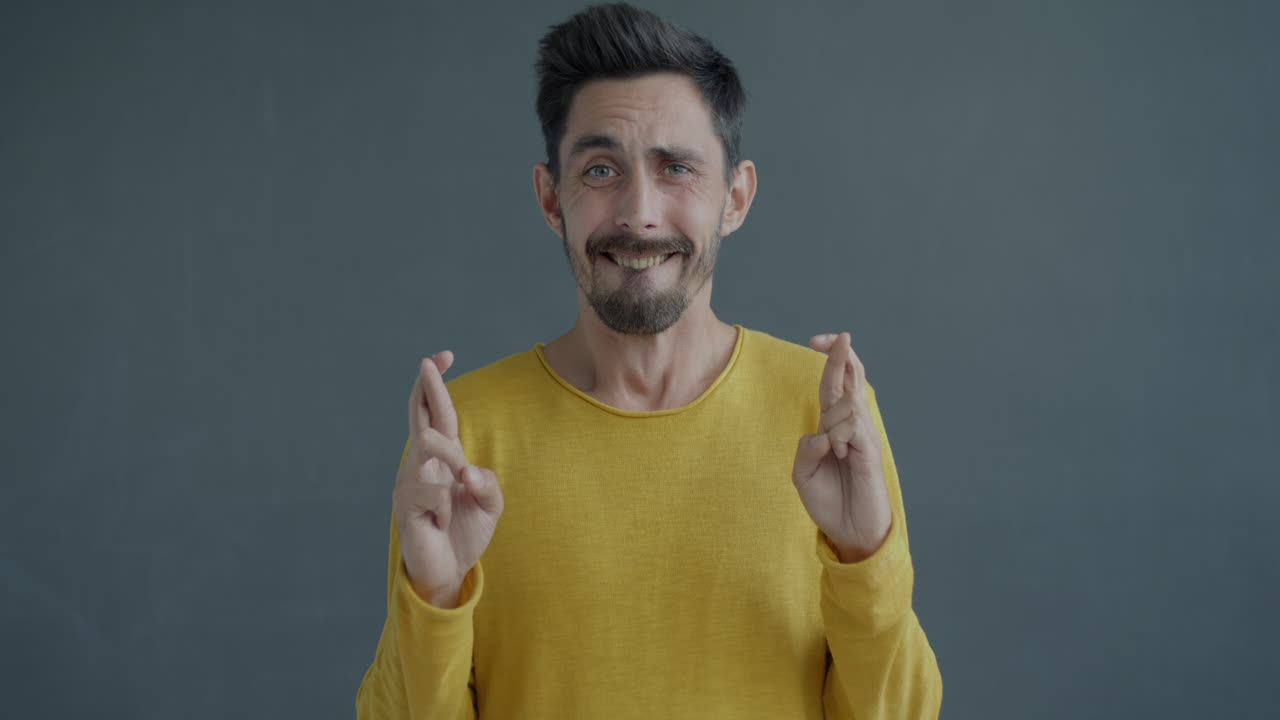 Man Crossing Fingers