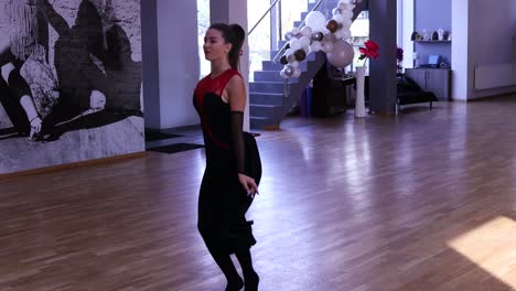 Female-dancer-warming-up-before-dancing