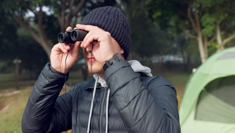 binoculars, nature and young man camping