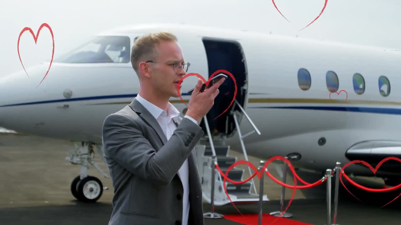 스마트폰을 사용하는 백인 사업가에 대한 심장 아이콘의 애니메이션