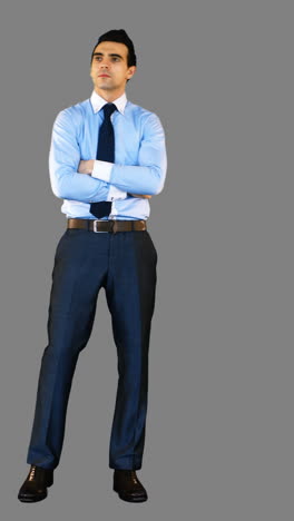 businessman standing with arms crossed