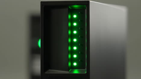 black server or storage device with green led indicator lights