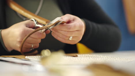 cutting leather with scissors