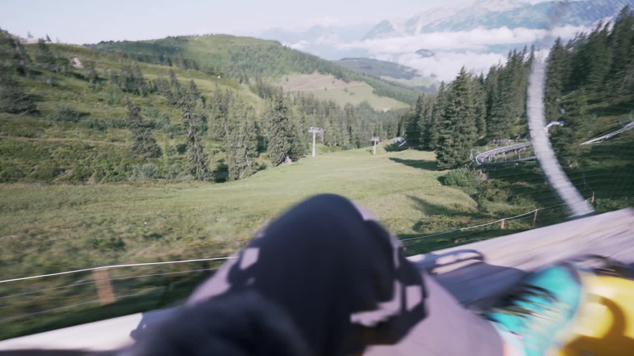 Fast moving shot of the coaster ride as it moves downward, POV shot