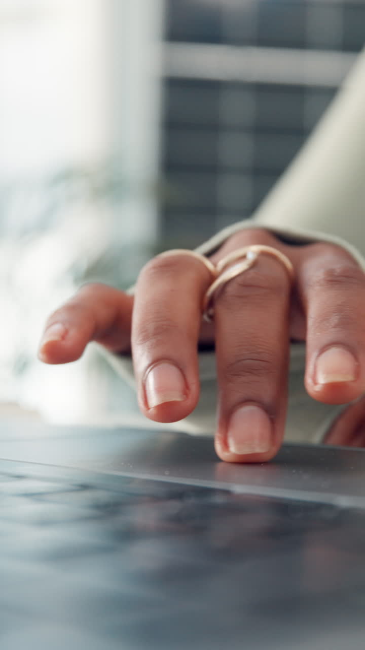 Close-up of a Person's Hand Resting on a Laptop
