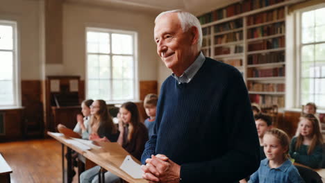 elderly teacher or professor in a classroom with students