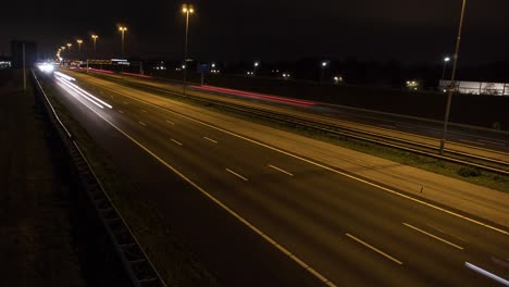 Luces-De-Coche-Por-La-Noche-En-El-Lapso-De-Tiempo-De-La-Carretera,-Tiro-Fijo