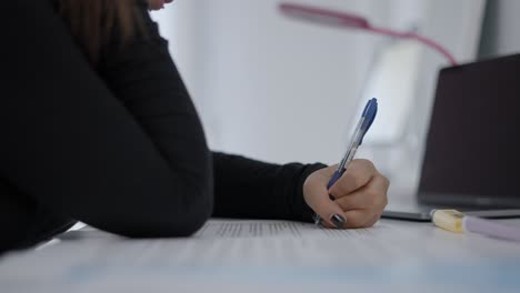 woman studying at her desk