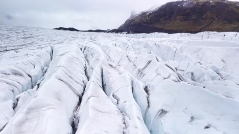 stunning winter landscape reveals deep crevasses and polar ice in iceland's glaciers