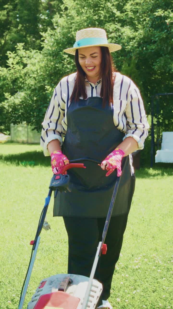 A Dedicated Gardener in Striped Shirt and Hat Mowing a Lush Green Lawn with Care, Wearing Colorful Gloves for Protection and Style in a Beautiful Outdoor Setting