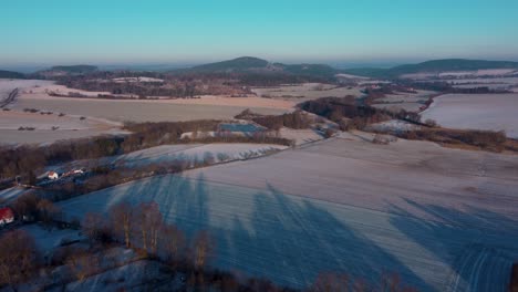 Aerial-view-of-Velký-Blaník-mountain-in-winter-with-snow-in-Bohemia,-Czechia