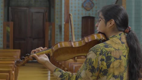 Violinist-Playing-Violin-Music-Instrument-in-Church,-Solo-Rehearsal-at-Medalla-Milagrosa-Church-in-Ecuador